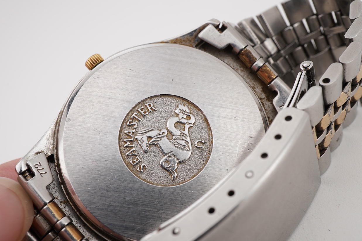A gentleman's early 1980's stainless steel and gold plated Omega Seamaster quartz wrist watch, with baton numerals and date aperture, movement c.1337, case diameter 34mm, on a steel and gold plated Omega bracelet, with s